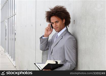 Portrait of a businessman working outside the office
