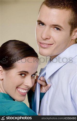Portrait of a businesswoman and a businessman smiling