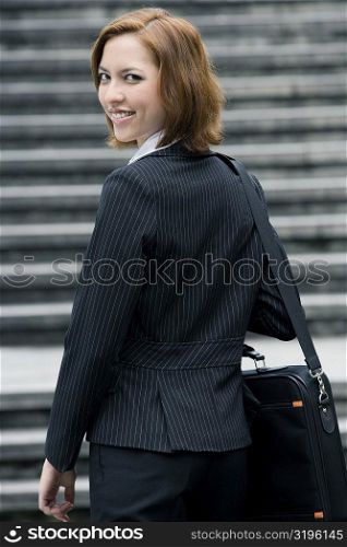 Portrait of a businesswoman carrying a shoulder bag