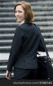 Portrait of a businesswoman carrying a shoulder bag