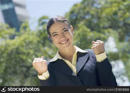 Portrait of a businesswoman clenching her fist