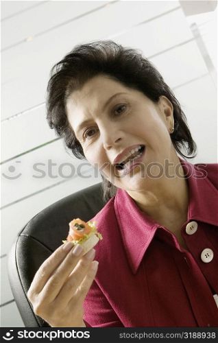 Portrait of a businesswoman having meal