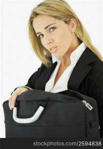 Portrait of a businesswoman holding a bag