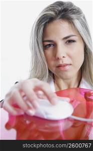 Portrait of a businesswoman holding a computer mouse