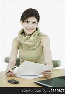Portrait of a businesswoman holding a document