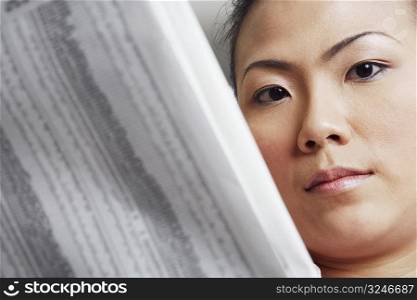 Portrait of a businesswoman holding a financial newspaper