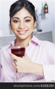 Portrait of a businesswoman holding a glass