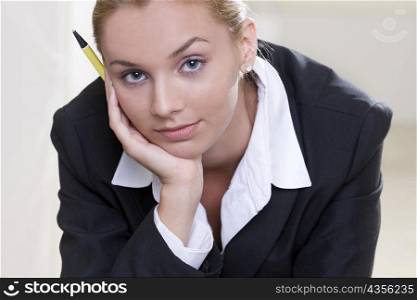 Portrait of a businesswoman holding a pen