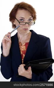 Portrait of a businesswoman holding a pen and a file