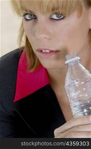 Portrait of a businesswoman holding a water bottle
