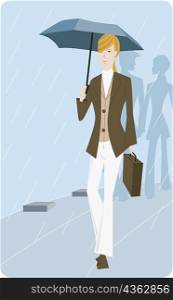 Portrait of a businesswoman holding an umbrella and walking