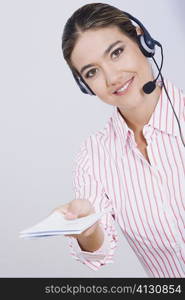 Portrait of a businesswoman holding documents and smiling