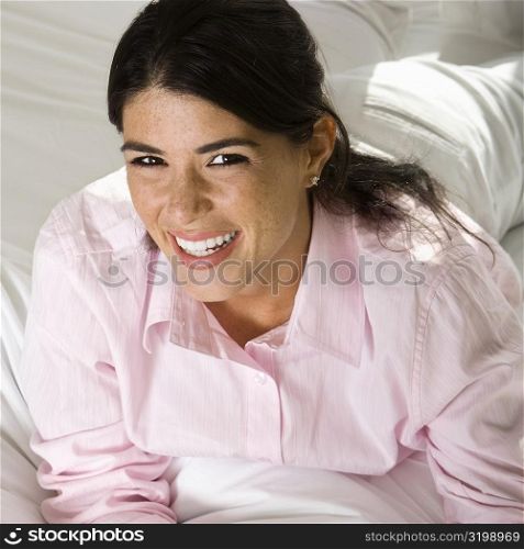 Portrait of a businesswoman lying on the bed