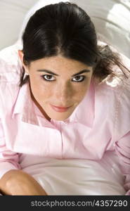 Portrait of a businesswoman lying on the bed