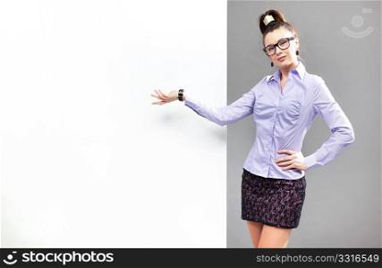 Portrait of a businesswoman pointing at the whiteboard
