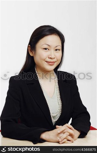 Portrait of a businesswoman sitting in an office and smiling