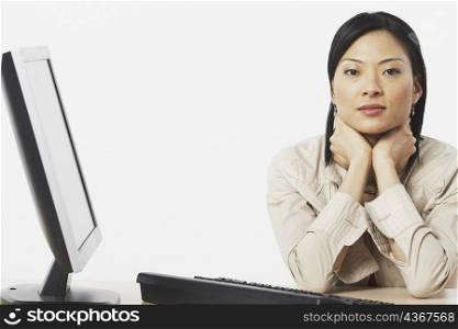 Portrait of a businesswoman sitting near a computer