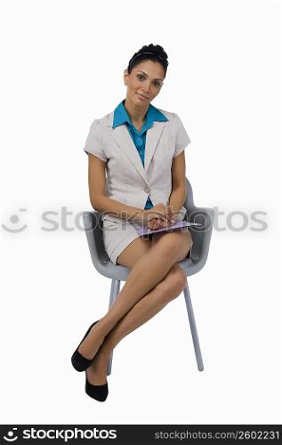 Portrait of a businesswoman sitting on a chair