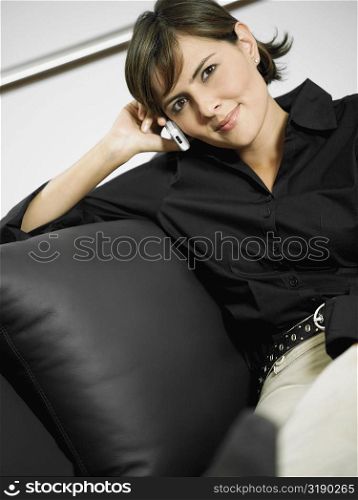 Portrait of a businesswoman smiling and talking on a mobile phone