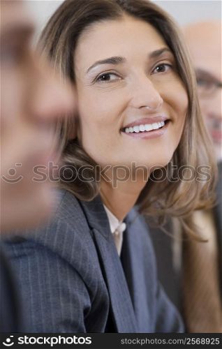 Portrait of a businesswoman smiling in a board room