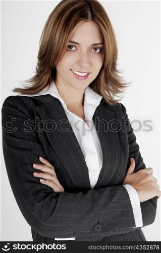 Portrait of a businesswoman smiling with her arms folded