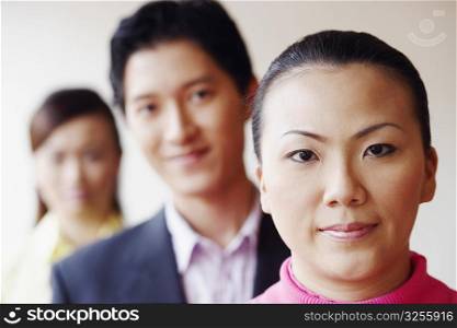 Portrait of a businesswoman smiling with her colleagues