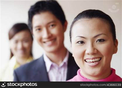Portrait of a businesswoman smiling with her colleagues