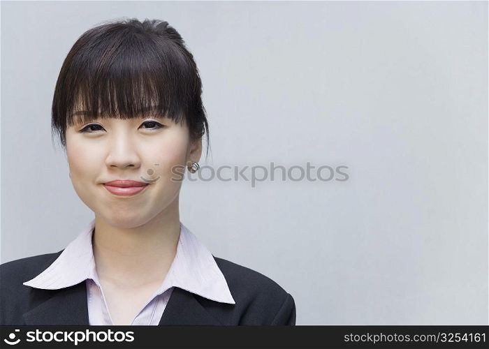 Portrait of a businesswoman smirking