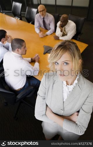 Portrait of a businesswoman standing in a board room