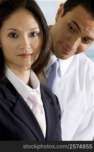 Portrait of a businesswoman standing with a businessman