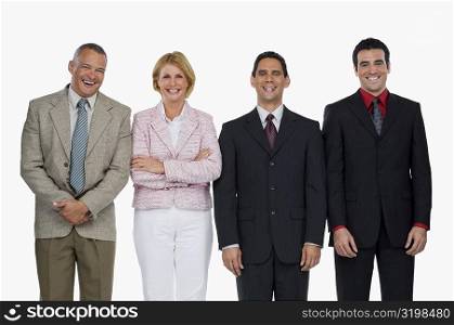 Portrait of a businesswoman standing with three businessmen and smiling