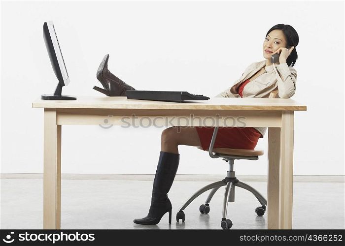 Portrait of a businesswoman talking on a cordless telephone