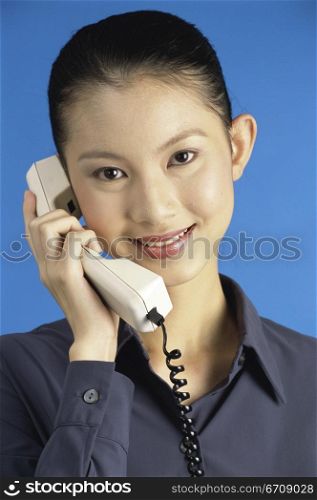 Portrait of a businesswoman talking on a telephone