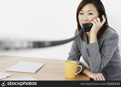 Portrait of a businesswoman talking on the telephone