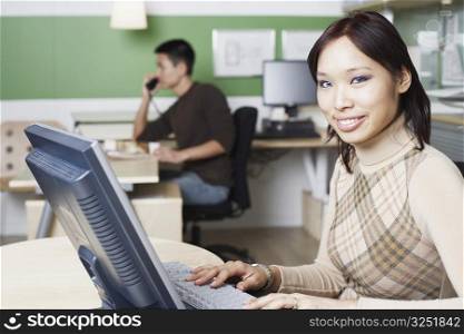 Portrait of a businesswoman using a computer