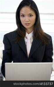 Portrait of a businesswoman using a laptop