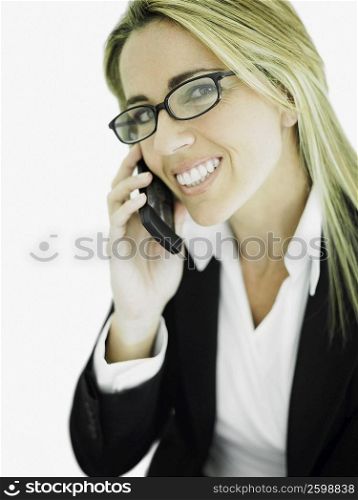 Portrait of a businesswoman using a mobile phone and smiling