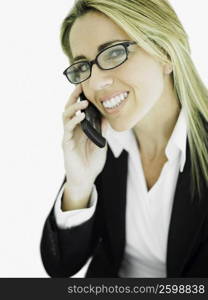 Portrait of a businesswoman using a mobile phone and smiling