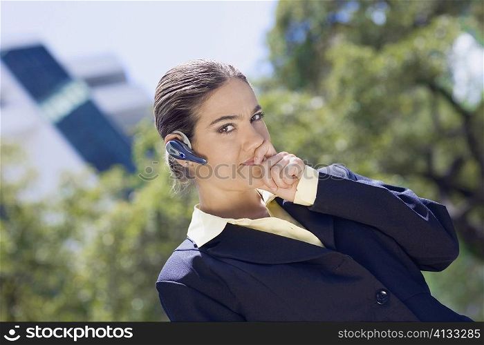 Portrait of a businesswoman wearing a hands free device