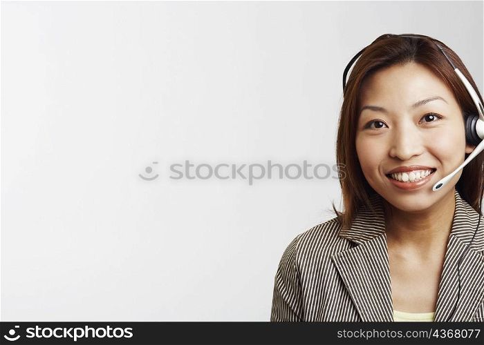 Portrait of a businesswoman wearing a headset and smiling