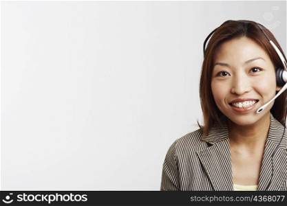 Portrait of a businesswoman wearing a headset and smiling
