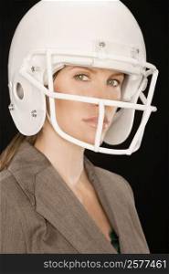 Portrait of a businesswoman wearing a sports helmet