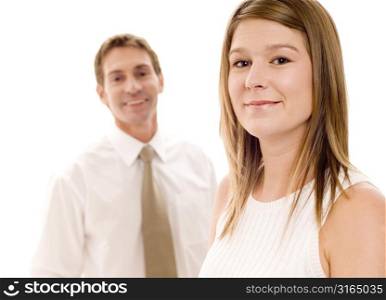 Portrait of a businesswoman with a businessman standing behind her
