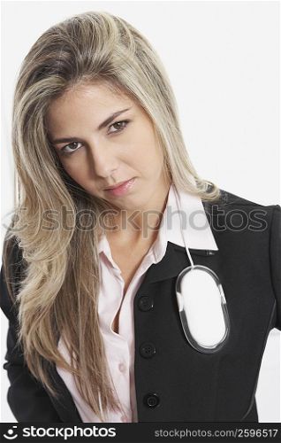 Portrait of a businesswoman with a computer mouse on her shoulder