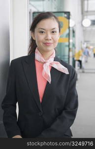Portrait of a cabin crew standing at an airport