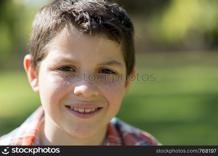 portrait of a casual teen boy, outdoors