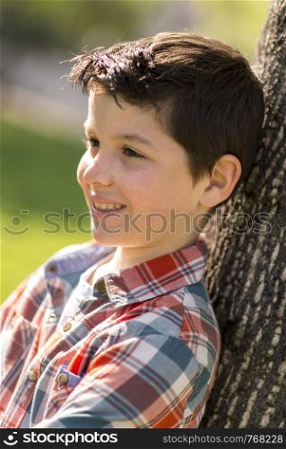 portrait of a casual teen boy, outdoors