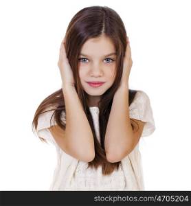 Portrait of a charming little girl covering ears with hands, isolated on white background