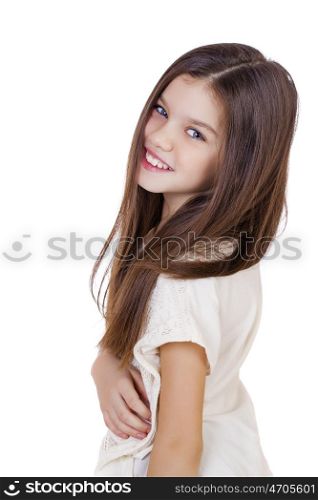 Portrait of a charming little girl smiling at camera, isolated on white background