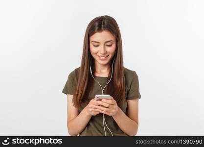 Portrait of a cheerful cute woman listening music in headphones and dancing isolated on a white background. Portrait of a cheerful cute woman listening music in headphones and dancing isolated on a white background.